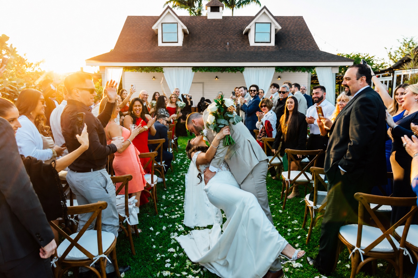 A wedding-day moment by the barn